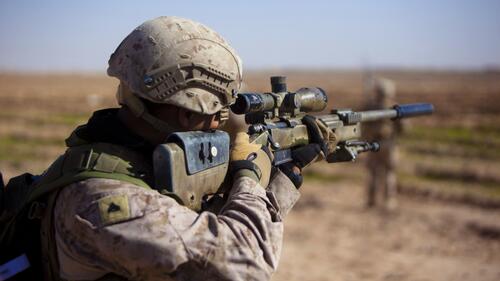 A soldier with an awm sniper rifle.
