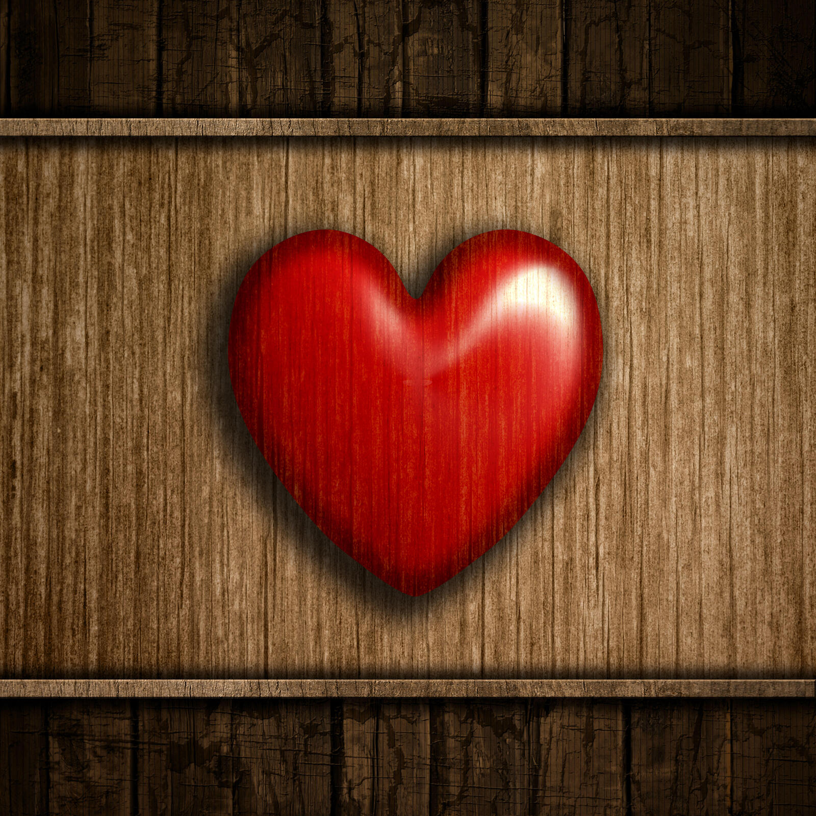 Free photo A red heart carved out of wood