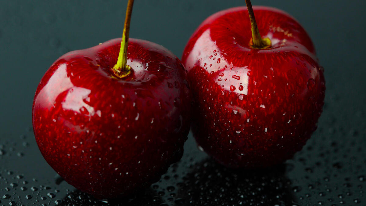 Two wet cherries