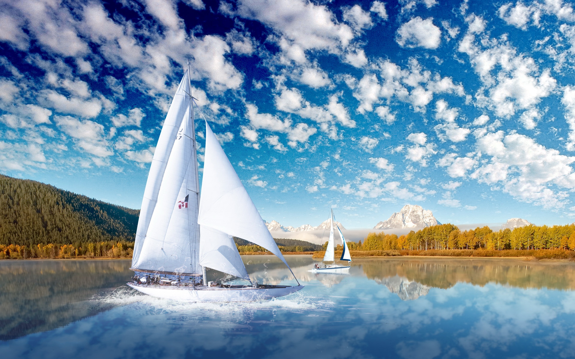 Free photo Two sailing ships with white sails