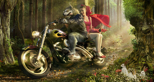 Little Red Riding Hood and the wolf are riding a motorcycle.