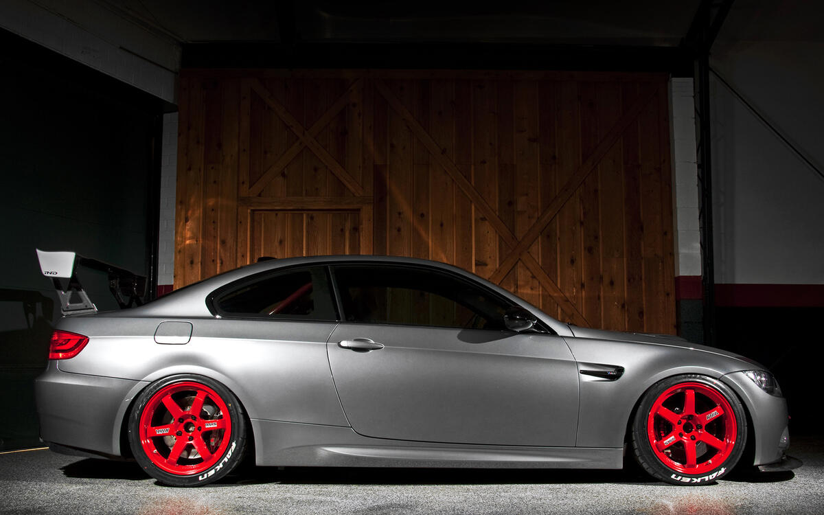 Silver bmw on red rims.