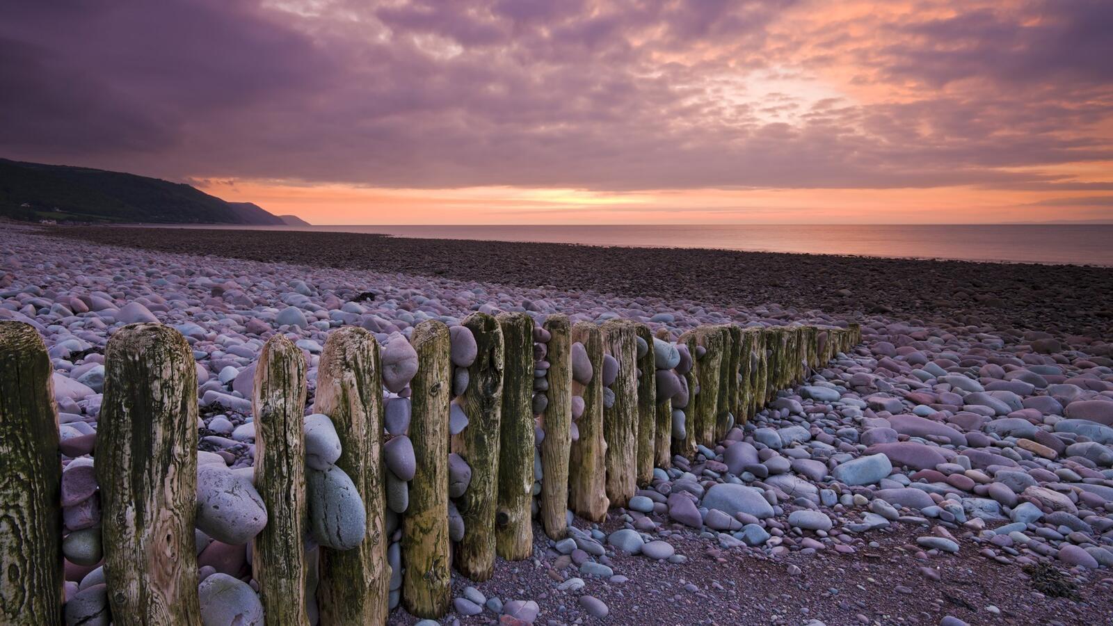 Wallpapers beach fence logs stones on the desktop