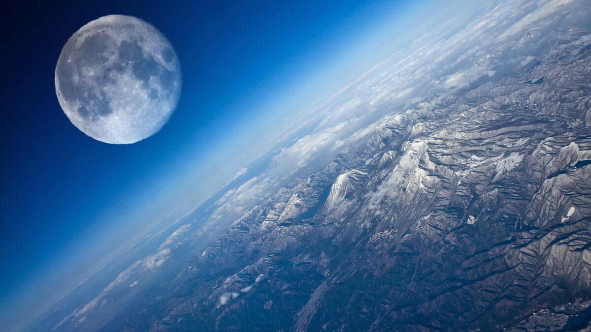 The large moon above the earth seen from space
