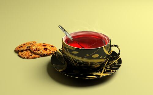 Hot tea with raisin cookies.
