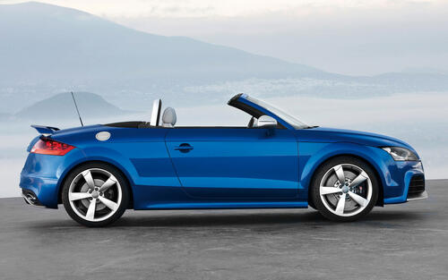 Blue audi tt in coupe body side view