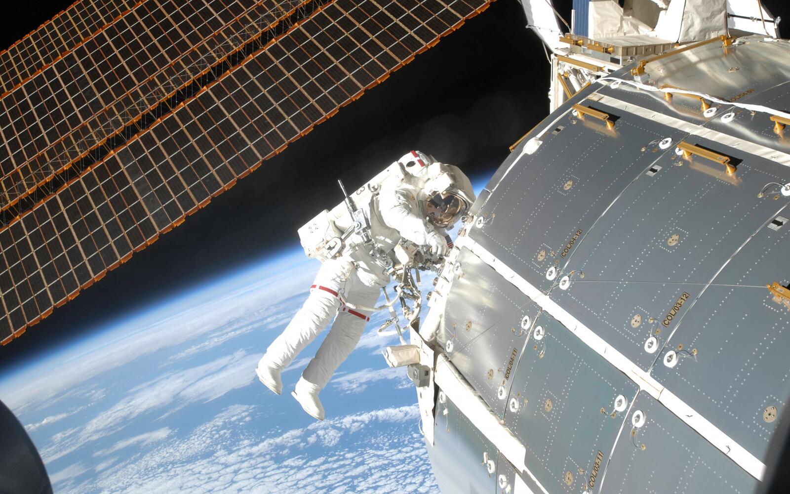 Wallpapers space station astronaut space suit on the desktop
