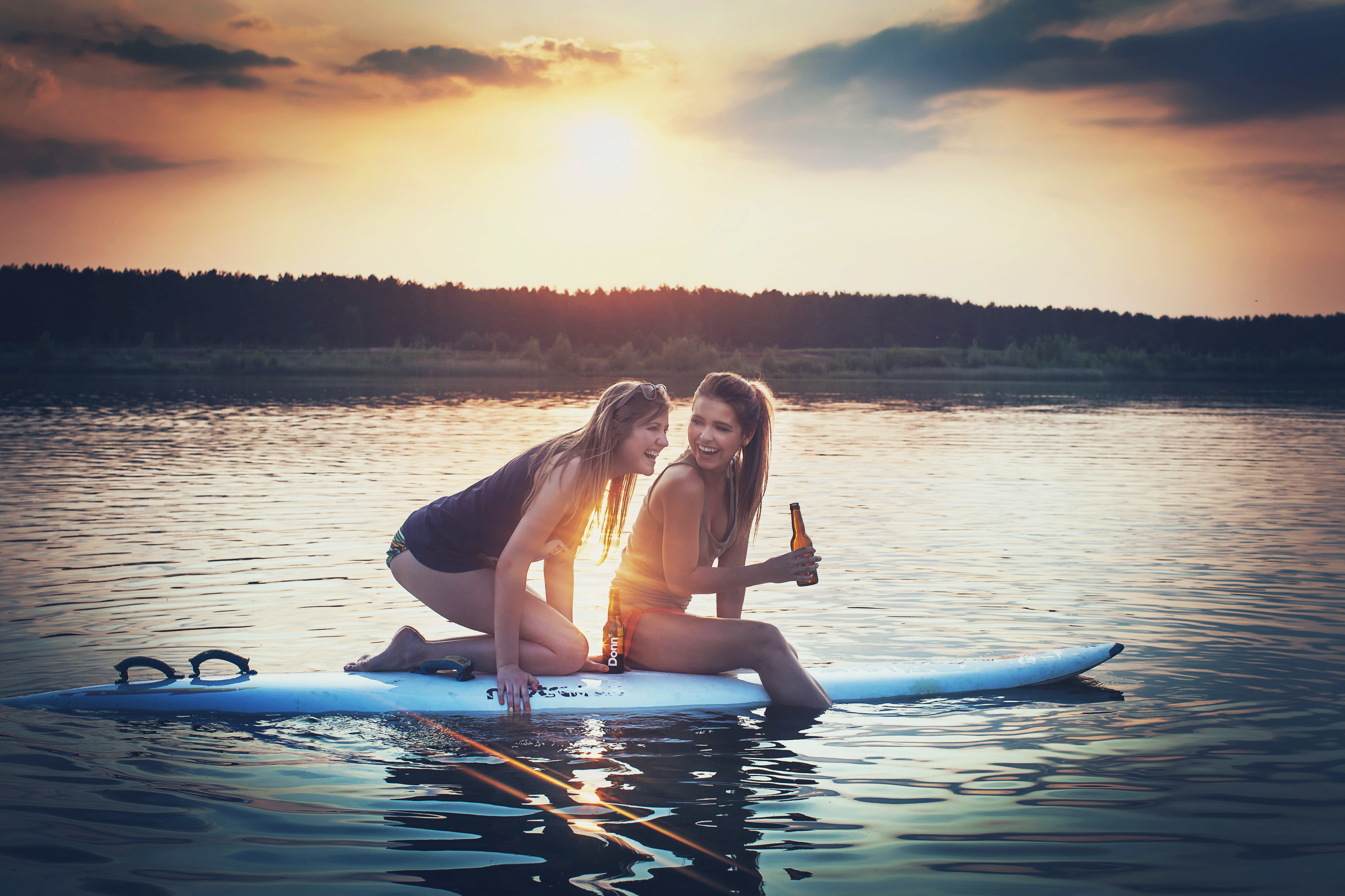 Wallpapers girls and surfing board sunset on the desktop