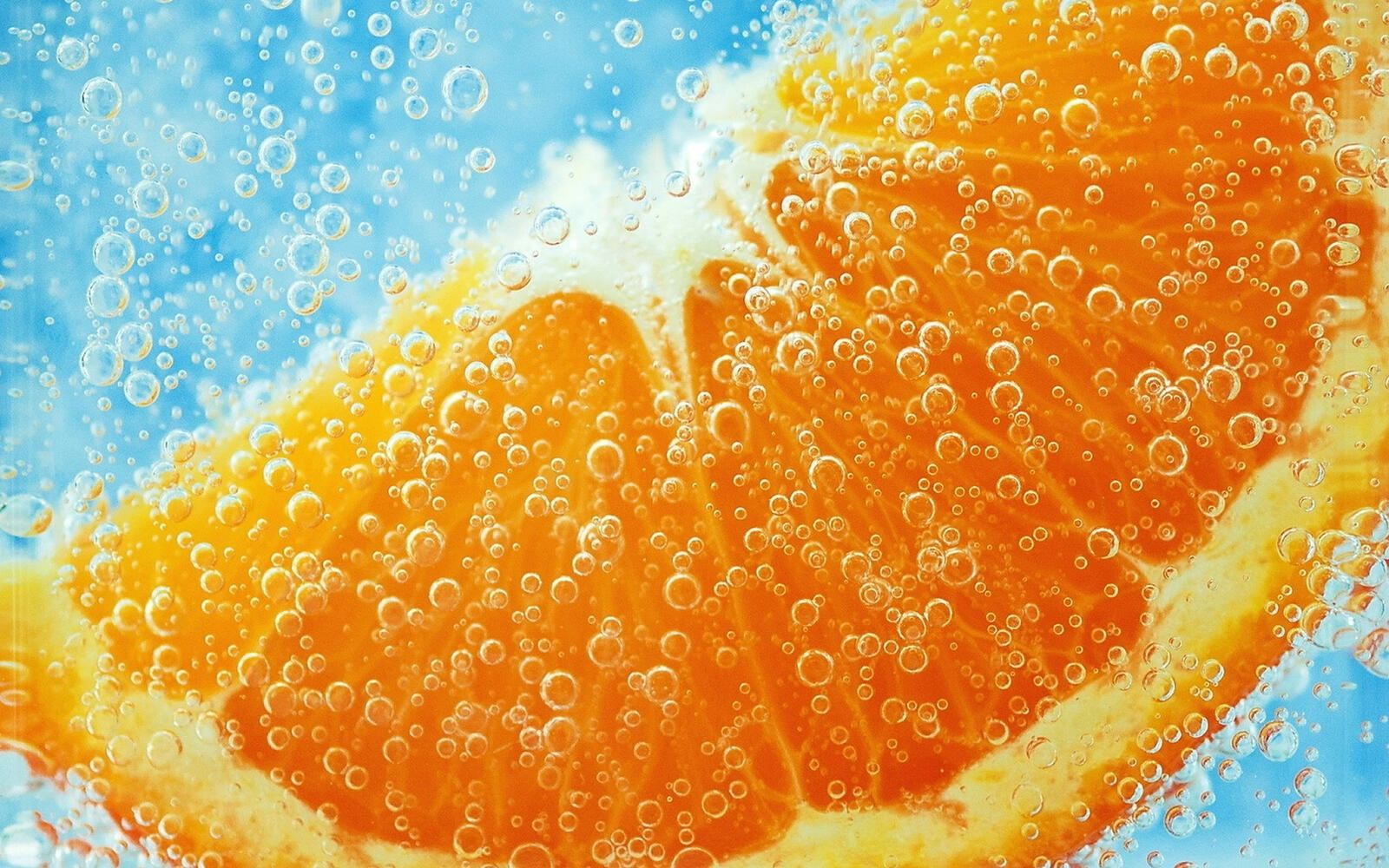 Wallpapers orange slice water on the desktop