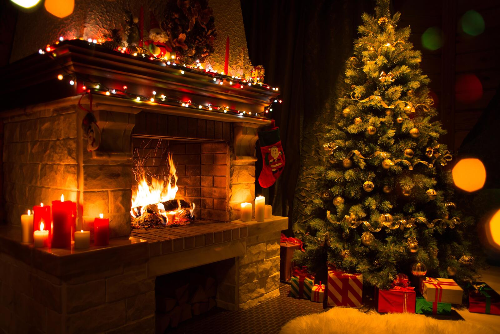 Wallpapers gifts New Year tree in the interior fireplace on the desktop