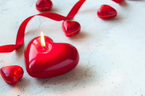 A heart-shaped candle for Valentine`s Day