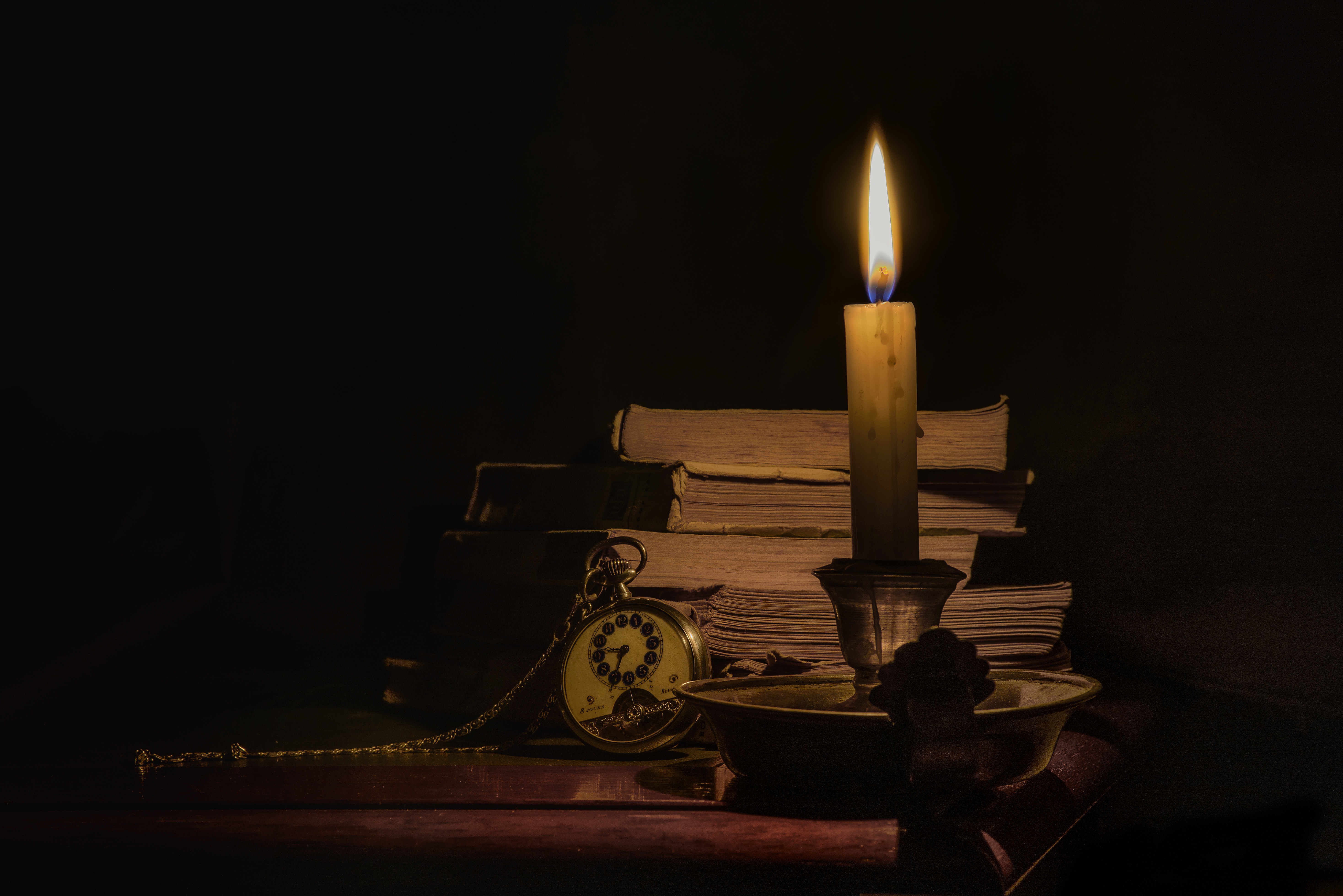 Wallpapers candle flame books on the desktop