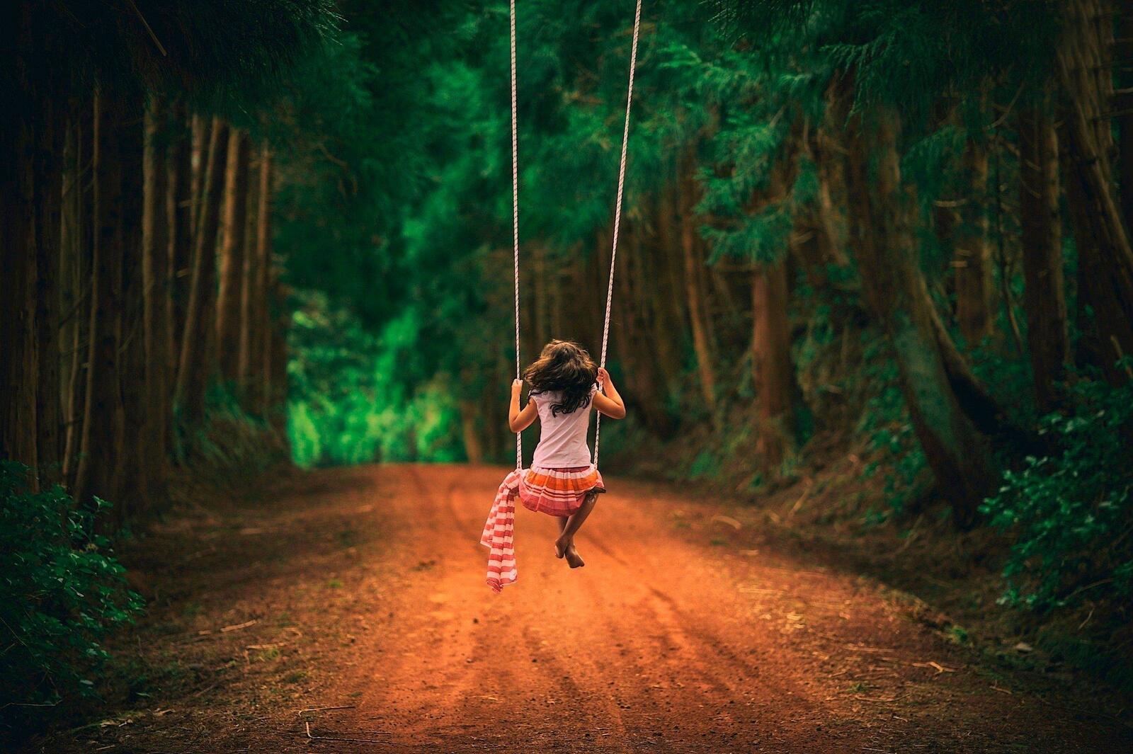 Wallpapers girl on swing forest road on the desktop