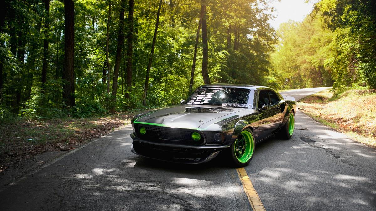 Sporty Ford Mustang on green wheels with shelves